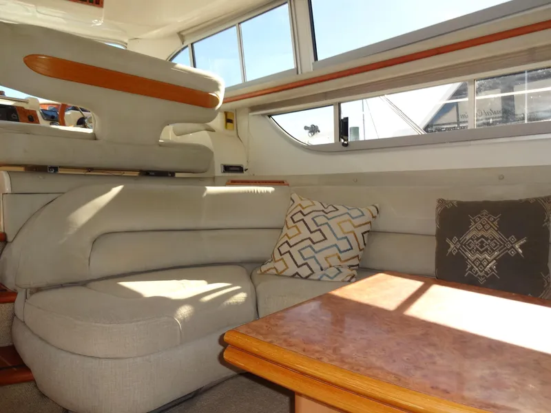 Slide: The Image of Interior of 1999 Sealine F44 yacht with beige seating and decorative pillows. - 27