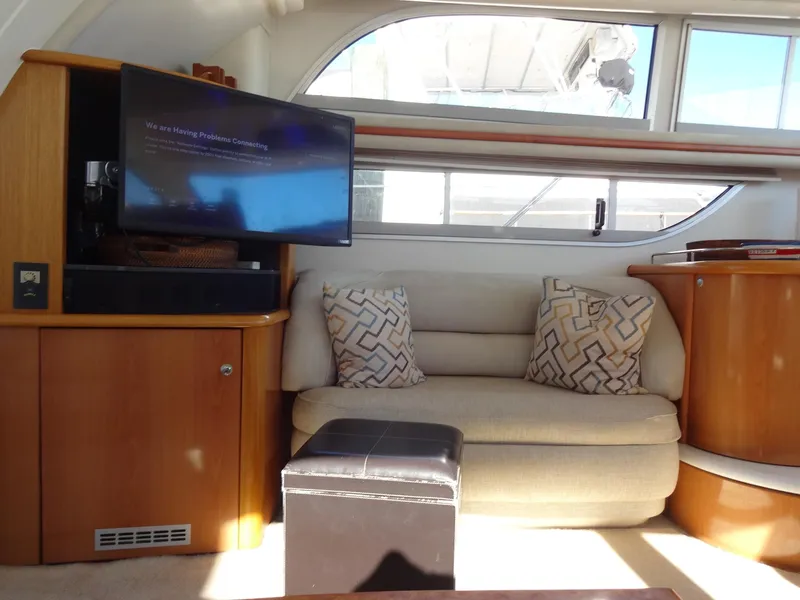 Slide: The Image of Interior of 1999 Sealine F44 yacht with cozy seating and modern decor. - 29