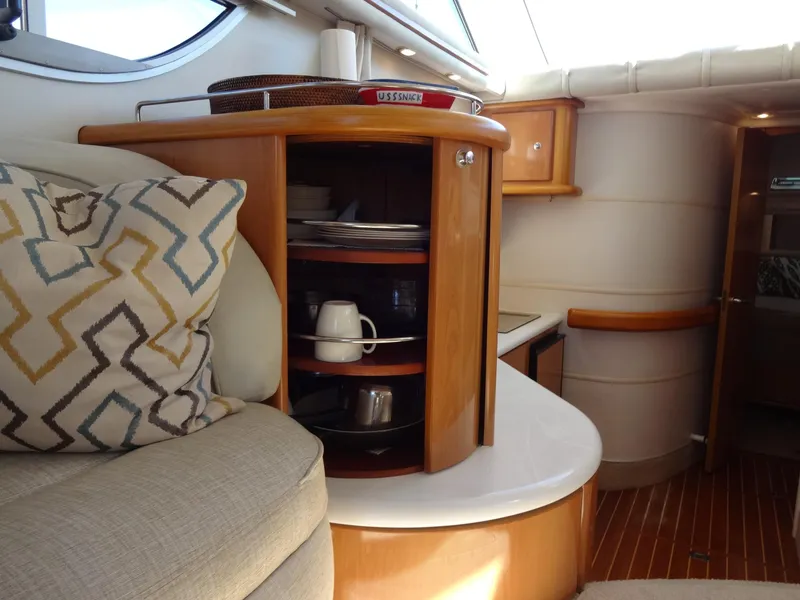 Slide: The Image of Interior of 1999 Sealine F44 yacht with wooden cabinetry and patterned cushions. - 31