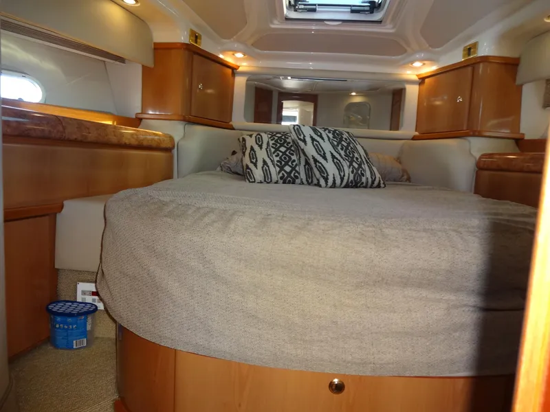 Slide: The Image of Interior of 1999 Sealine F44 yacht with cozy bed and wooden cabinetry. - 48