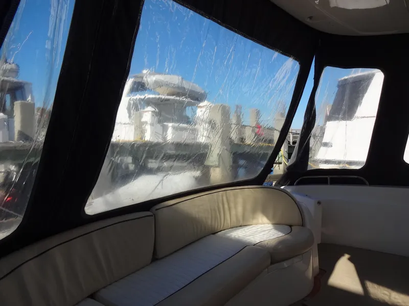 Slide: The Image of Interior view of 1999 Sealine F44 yacht with clear windows and beige seating. - 7