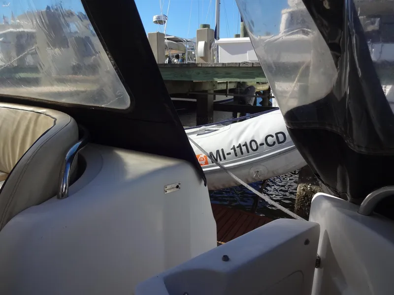 Slide: The Image of Interior view of a 1999 Sealine F44 yacht with docked inflatable boat. - 8