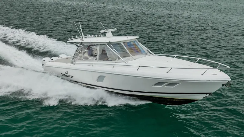 Slide: The Image of 2016 Intrepid 400 Cuddy cruising on open water, showcasing sleek design and performance. - 1