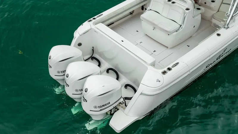 Slide: The Image of 2016 Intrepid 400 Cuddy boat with triple Yamaha outboard engines on turquoise water. - 20