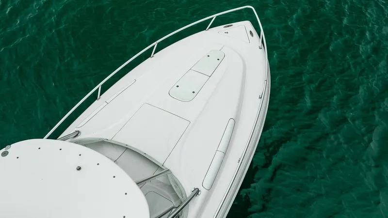 Slide: The Image of 2016 Intrepid 400 Cuddy boat on clear green water. - 21