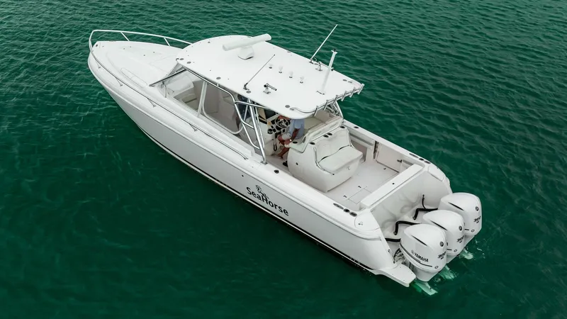Slide: The Image of 2016 Intrepid 400 Cuddy boat on clear water, aerial view. - 22