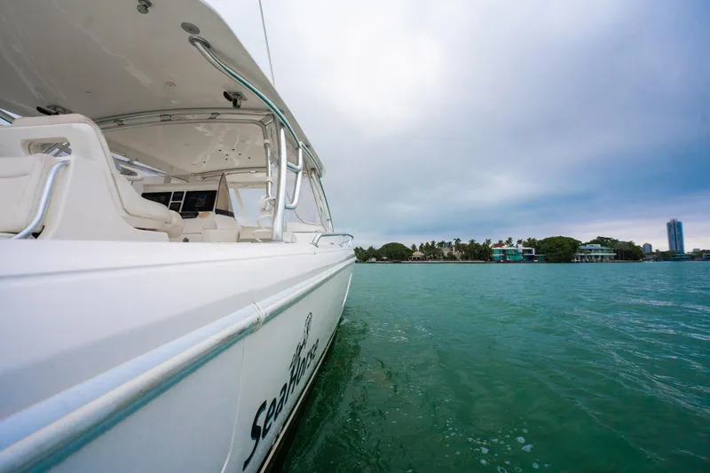 Slide: The Image of 2016 Intrepid 400 Cuddy boat on calm water, cloudy sky in the background. - 26
