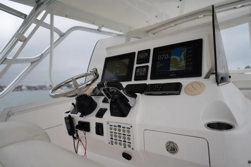 Slide: The Image of 2016 Intrepid 400 Cuddy helm with modern navigation equipment and controls. - 35