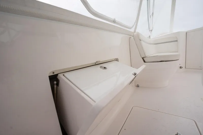 Slide: The Image of 2016 Intrepid 400 Cuddy interior with seating and storage compartment. - 37