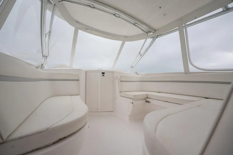 Slide: The Image of 2016 Intrepid 400 Cuddy interior with sleek white seating and panoramic windows. - 38
