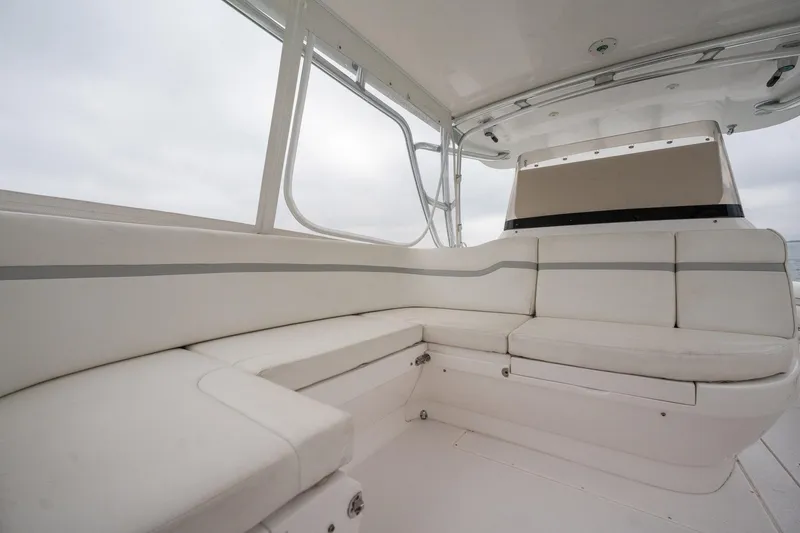 Slide: The Image of 2016 Intrepid 400 Cuddy interior with white seating and sleek design. - 40