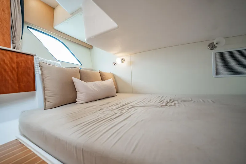 Slide: The Image of Interior cabin of 2016 Intrepid 400 Cuddy with cozy bed and cushions. - 46