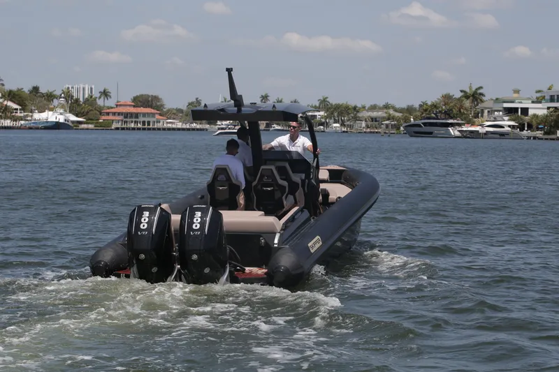 Slide: The Image of Skipper-BSK 34 boat cruising on water, 2025 model, with dual engines. - 0