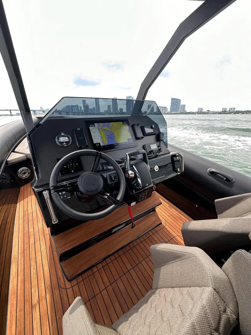 Slide: The Image of 2025 Skipper-BSK 34 boat cockpit with modern navigation system and wooden deck. - 20