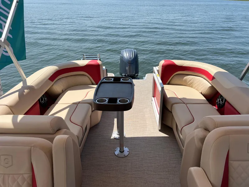 Slide: The Image of 2025 Godfrey SWEETWATER 2286 SB pontoon boat interior with beige and red seating. - 4