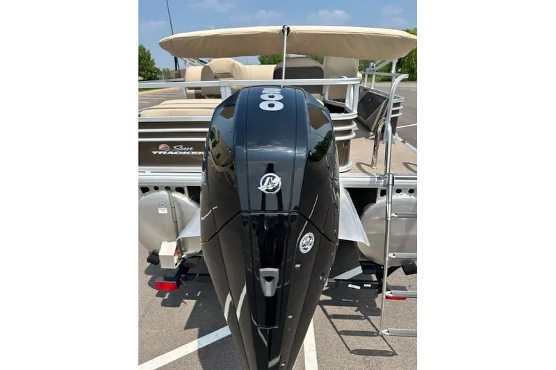 Slide: The Image of 2023 Sun Tracker SportFish 22 XP3 pontoon boat with powerful outboard motor. - 11