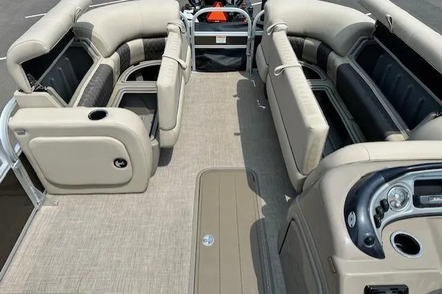 Slide: The Image of 2023 Sun Tracker SportFish 22 XP3 pontoon boat interior with spacious seating and modern dashboard. - 2