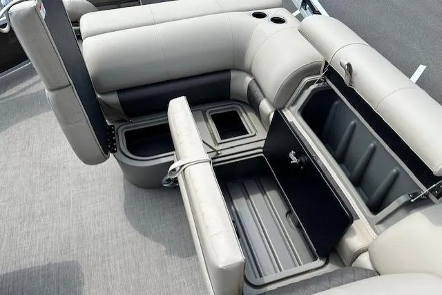 Slide: The Image of 2023 Sun Tracker SportFish 22 XP3 boat interior with open storage compartments. - 8