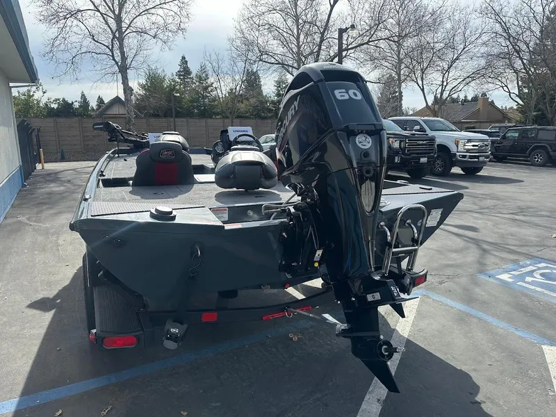Slide: The Image of 2025 Ranger RT178 boat with 60 HP motor in parking lot. - 10