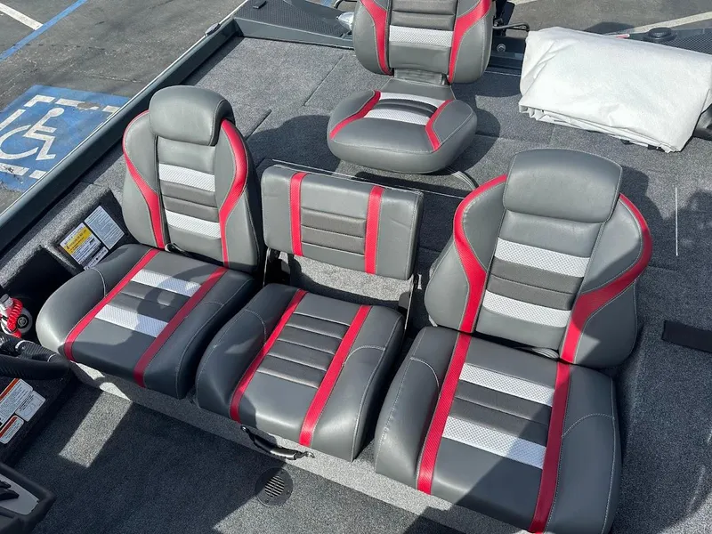 Slide: The Image of 2025 Ranger RT178 boat seats with red and gray upholstery. - 14