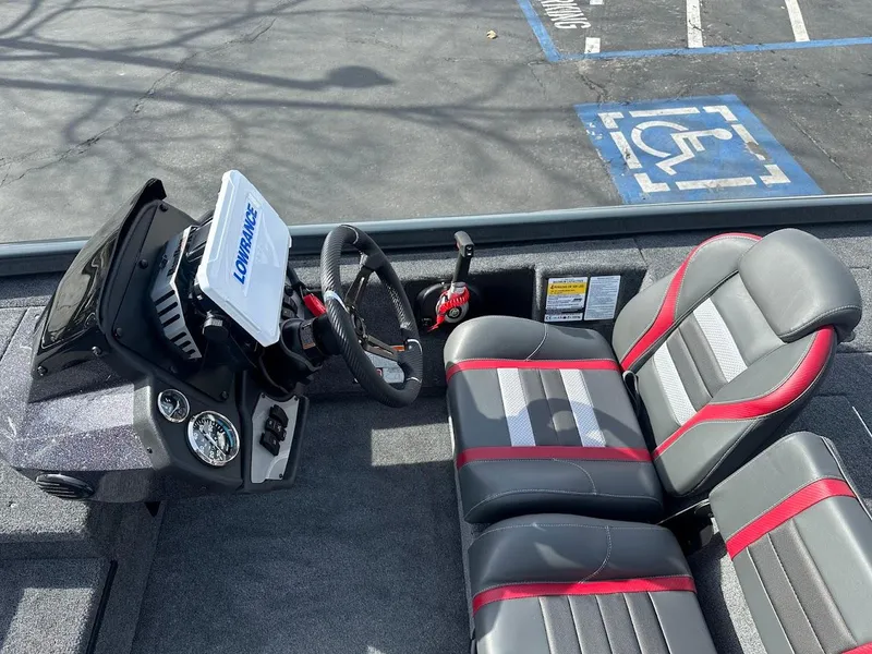 Slide: The Image of 2025 Ranger RT178 boat interior with steering wheel and dual seats. - 15