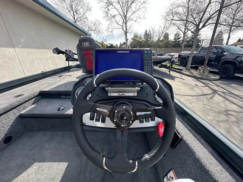 Slide: The Image of 2025 Ranger RT178 boat dashboard with steering wheel and navigation system. - 16