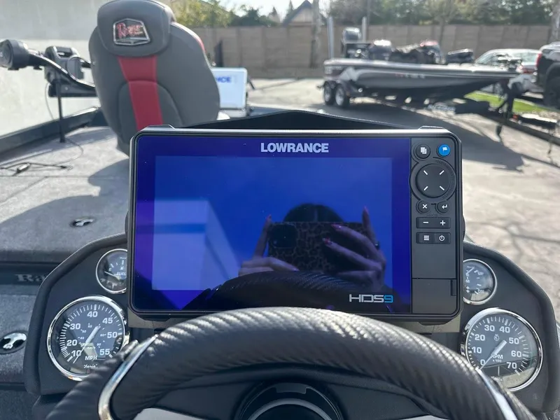 Slide: The Image of Lowrance HDS9 display on 2025 Ranger RT178 boat dashboard, with steering wheel and gauges visible. - 17