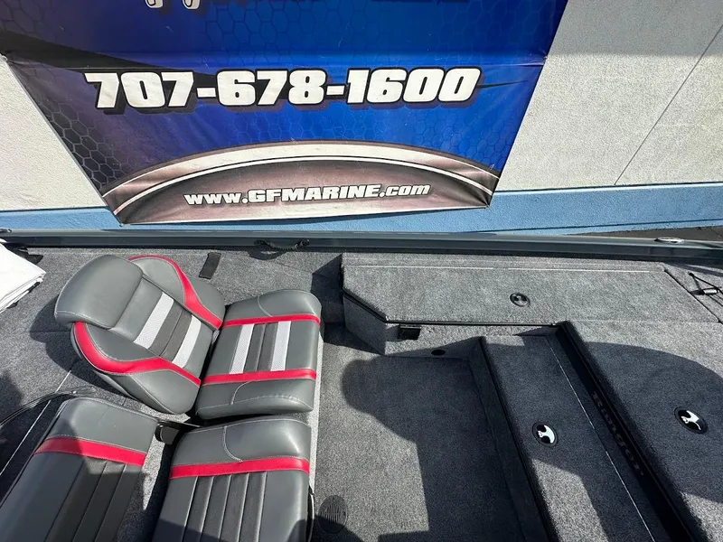 Slide: The Image of 2025 Ranger RT178 boat interior with gray and red seats, displayed at GF Marine. - 19