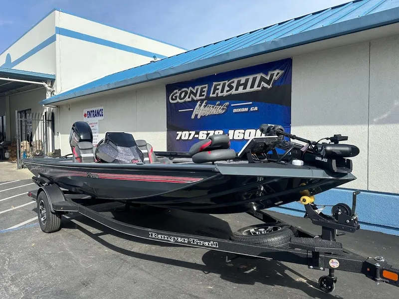 Slide: The Image of 2025 Ranger RT178 boat on trailer outside dealership, "Gone Fishin'" sign visible. - 2