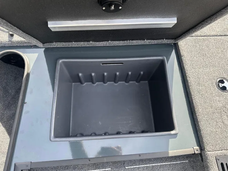 Slide: The Image of 2025 Ranger RT178 boat storage compartment, open and empty, with gray interior. - 27
