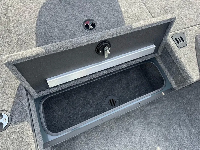 Slide: The Image of 2025 Ranger RT178 boat storage compartment with open lid, showcasing interior space. - 29