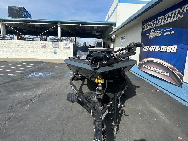 Slide: The Image of 2025 Ranger RT178 boat on trailer outside a marine shop. - 3