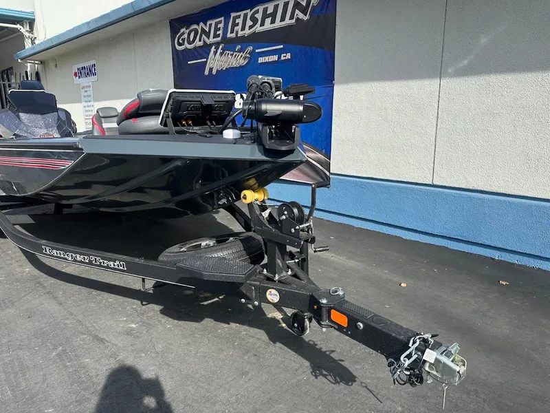 Slide: The Image of 2025 Ranger RT178 boat on trailer outside "Gone Fishin" store. - 5