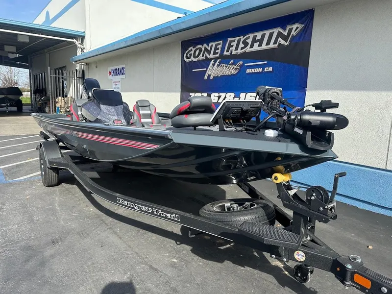 Slide: The Image of 2025 Ranger RT178 fishing boat on trailer outside dealership. - 6