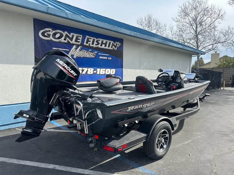 Slide: The Image of 2025 Ranger RT178 boat with Mercury engine at dealership, "Gone Fishin'" sign in background. - 8