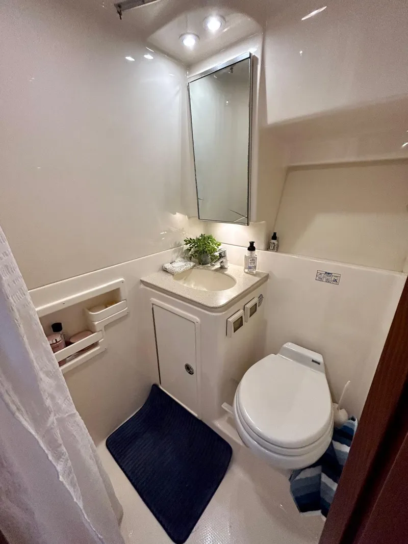 Slide: The Image of 2007 TIARA 36 OPEN yacht bathroom with modern fixtures and compact design. - 11