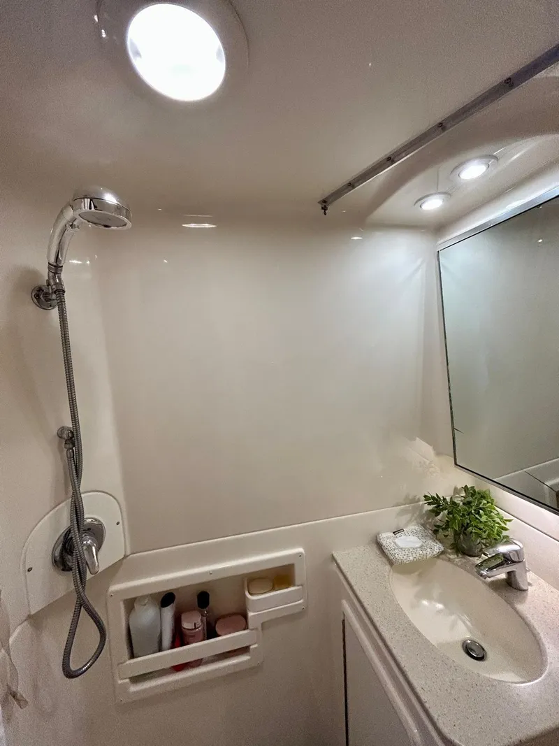 Slide: The Image of Bathroom interior of 2007 Open TIARA 36, featuring shower, sink, and mirror. - 12