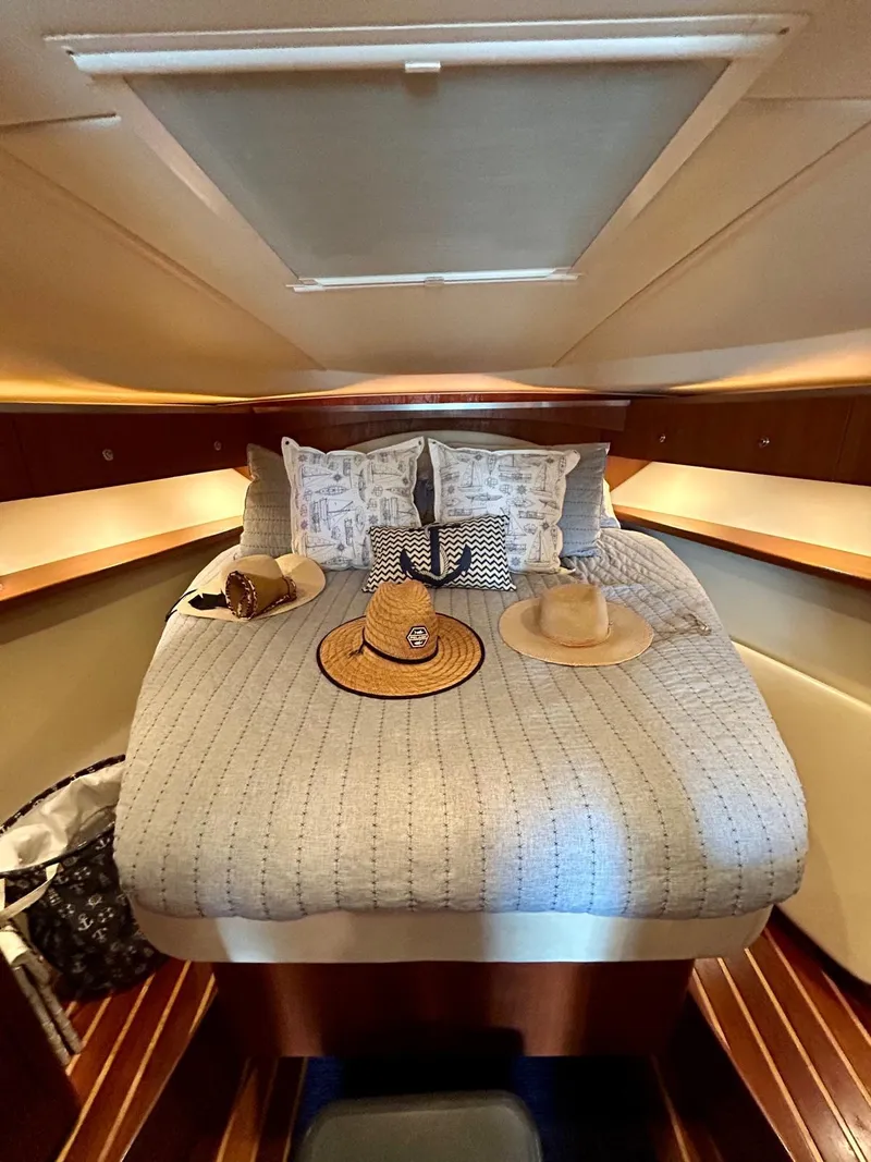 Slide: The Image of Cozy cabin interior of 2007 TIARA 36 OPEN yacht with stylish bedding and decor. - 13
