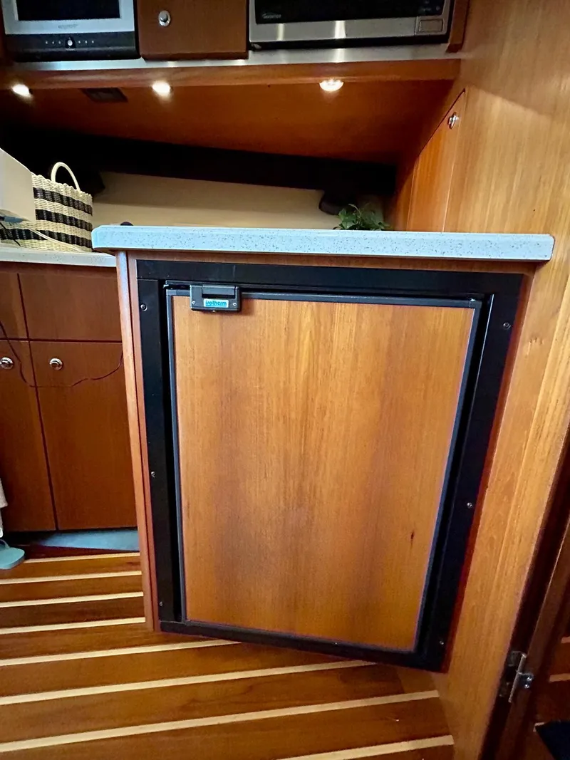 Slide: The Image of Wooden cabinet in 2007 Open TIARA 36 yacht interior with modern appliances. - 14