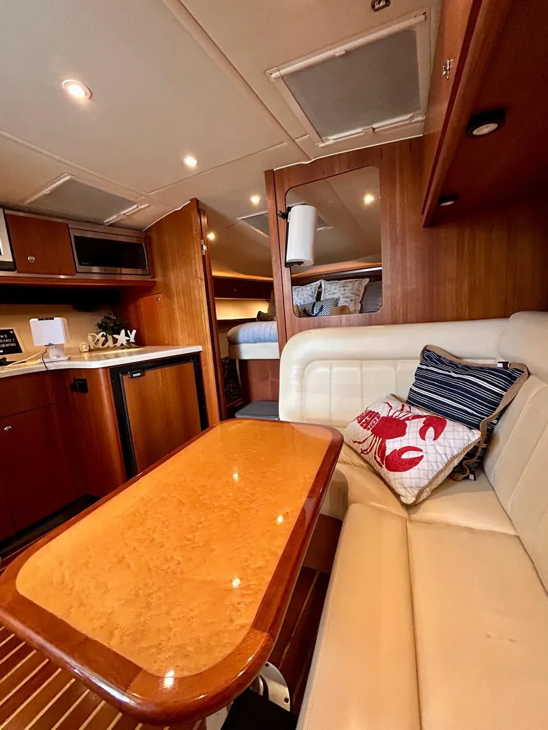 Slide: The Image of Luxurious interior of 2007 Open TIARA 36 yacht with elegant seating and wooden finishes. - 18