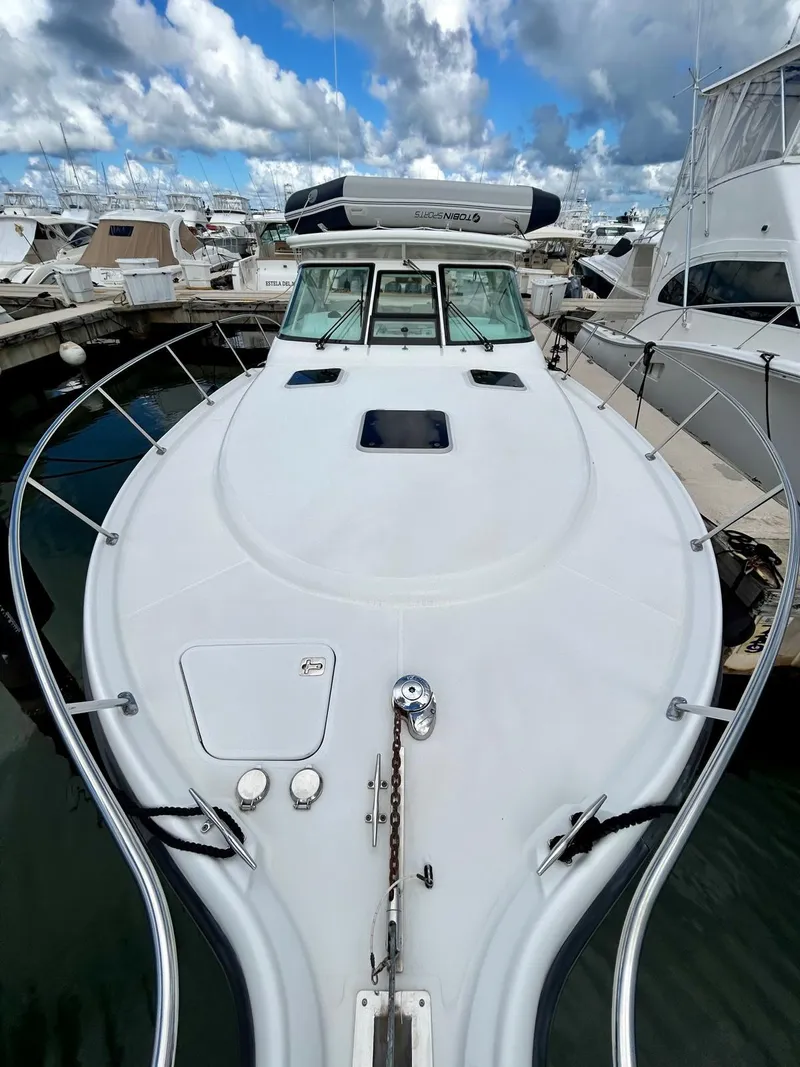 Slide: The Image of 2007 Open TIARA 36 boat docked at marina under cloudy sky. - 20