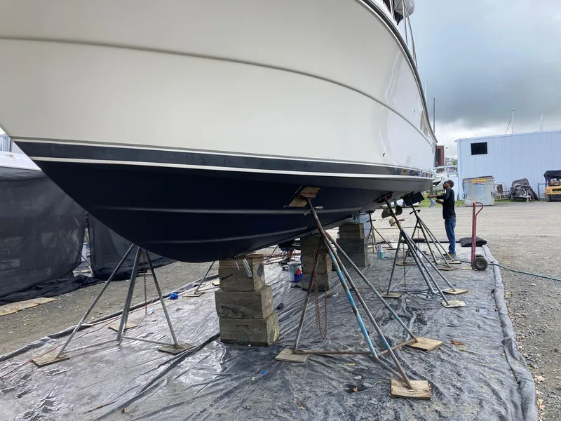 Slide: The Image of 2007 Open TIARA 36 boat on stands for maintenance at a shipyard. - 23