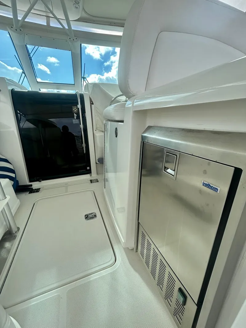 Slide: The Image of 2007 TIARA 36 OPEN yacht interior with stainless steel appliances and bright natural lighting. - 5
