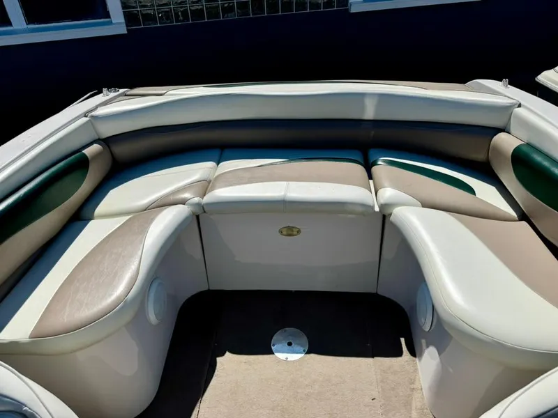 Slide: The Image of 1998 Four Winns Sundowner 205 boat interior with cushioned seating. - 3
