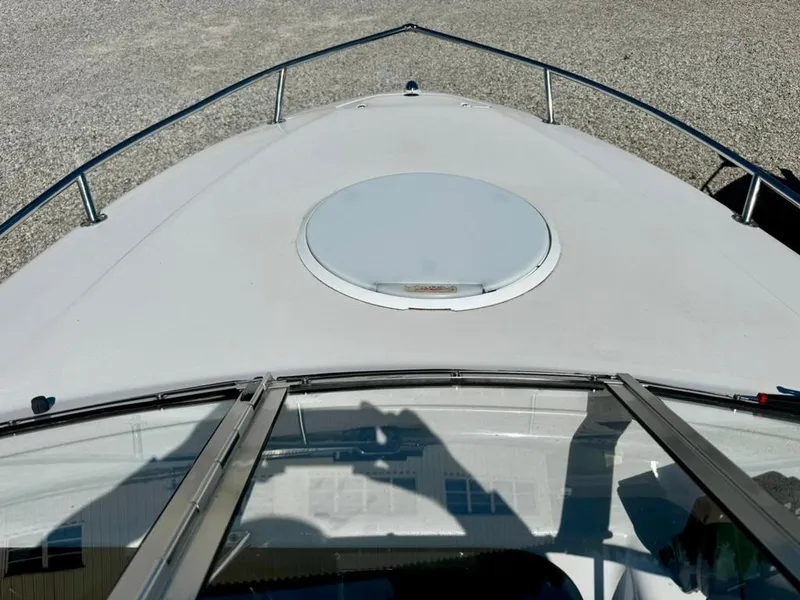 Slide: The Image of 1998 Four Winns Sundowner 205 boat deck with hatch, viewed from cockpit. - 6