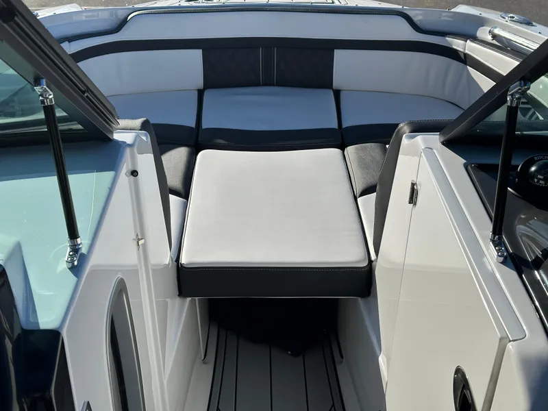 Slide: The Image of 2025 Monterey M4 boat dashboard with steering wheel, navigation screen, and gauges. - 10