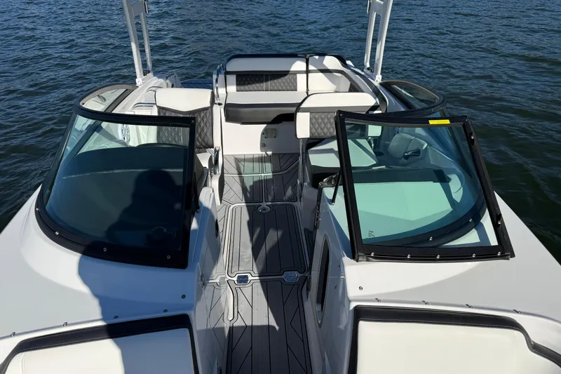 Slide: The Image of 2025 Monterey M4 boat interior with open cockpit and seating on water. - 14