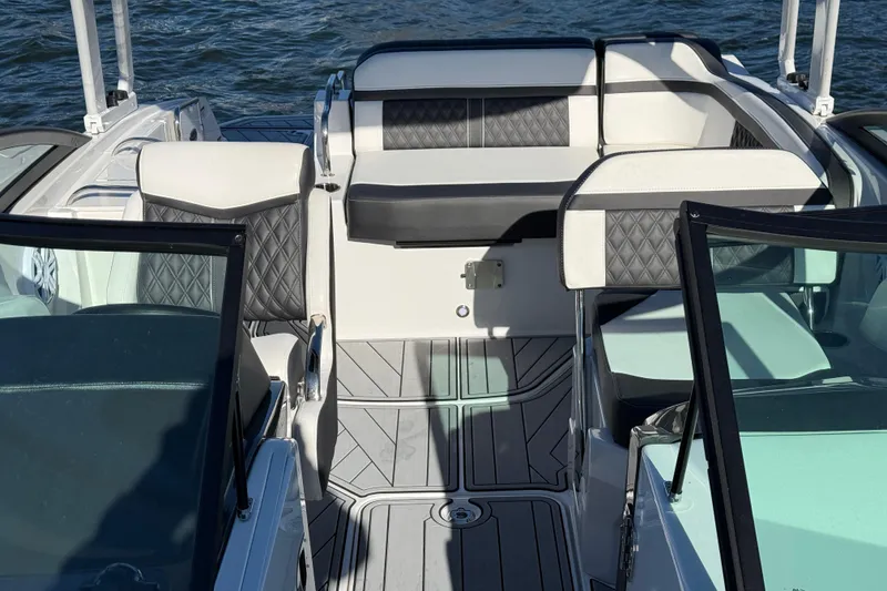Slide: The Image of 2025 Monterey M4 boat interior with stylish seating and modern design on the water. - 15