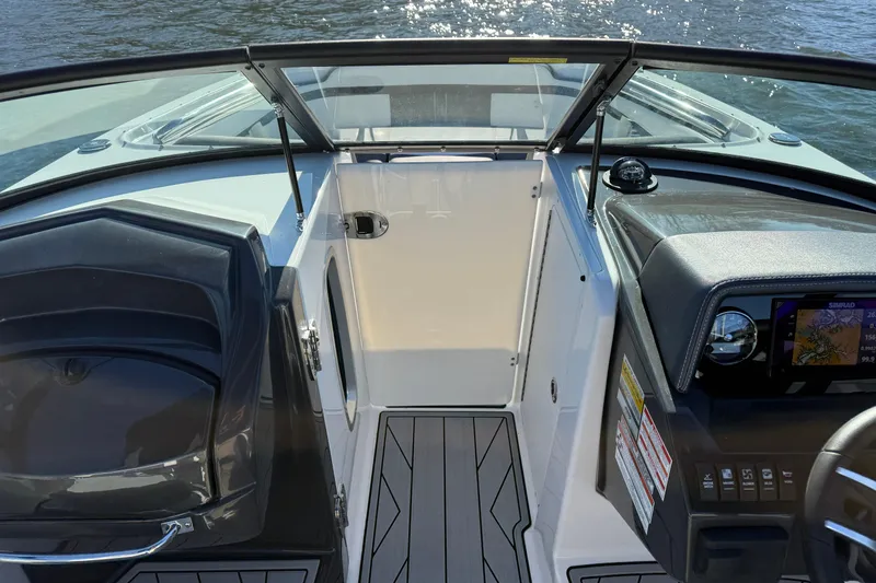 Slide: The Image of Interior view of 2025 Monterey M4 boat cockpit with modern dashboard and seating. - 16