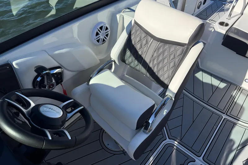 Slide: The Image of Luxury cockpit of 2025 Monterey M4 boat with sleek steering and cushioned seating. - 18